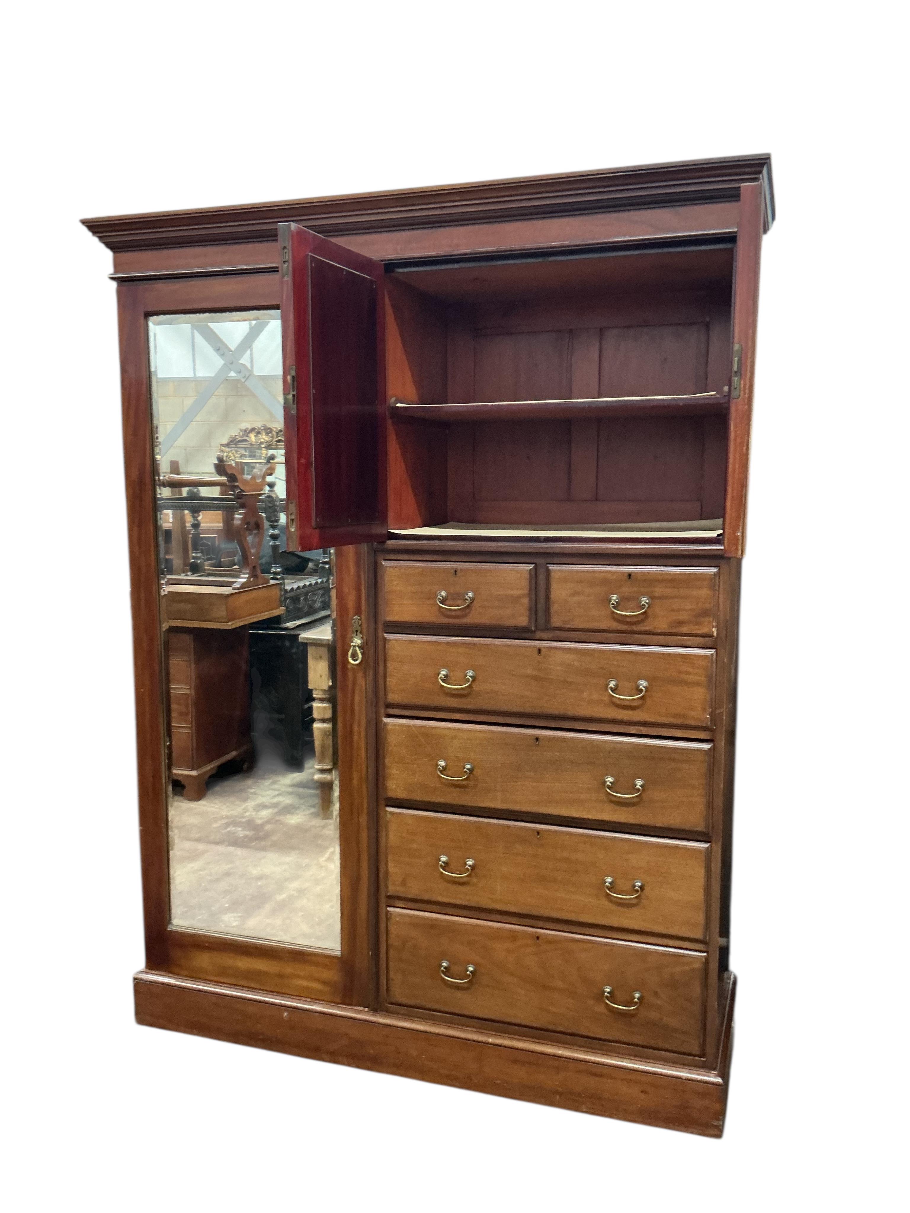 An early 20th century mahogany mirrored compactum wardrobe, width 154cm, depth 50cm, height 208cm